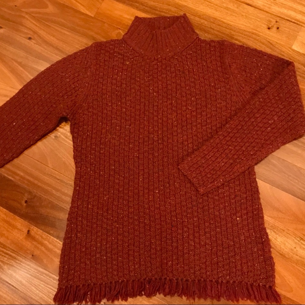 Oversized cable knit sweater with fringe